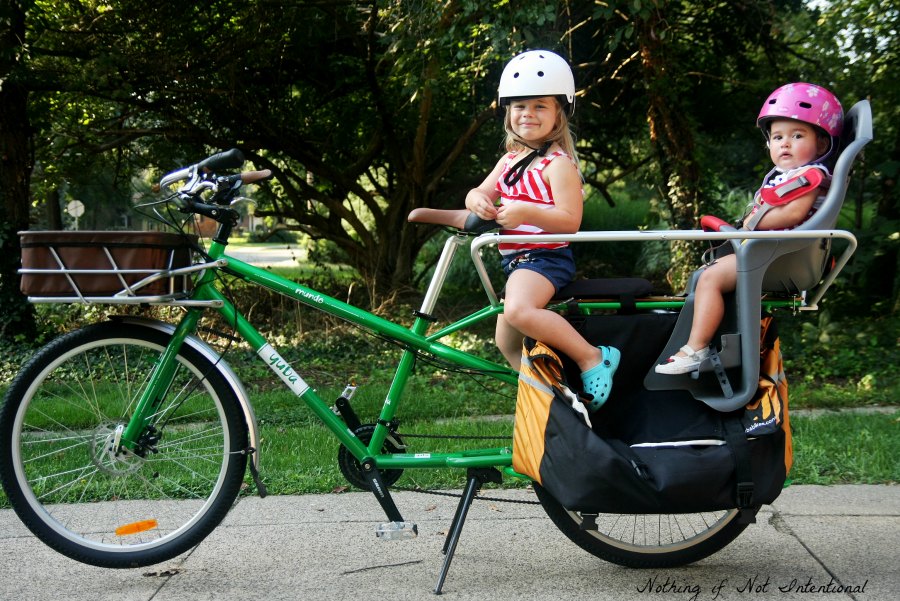 A Guide to Biking with Kids. The pros and cons of kids' bike gear options. 